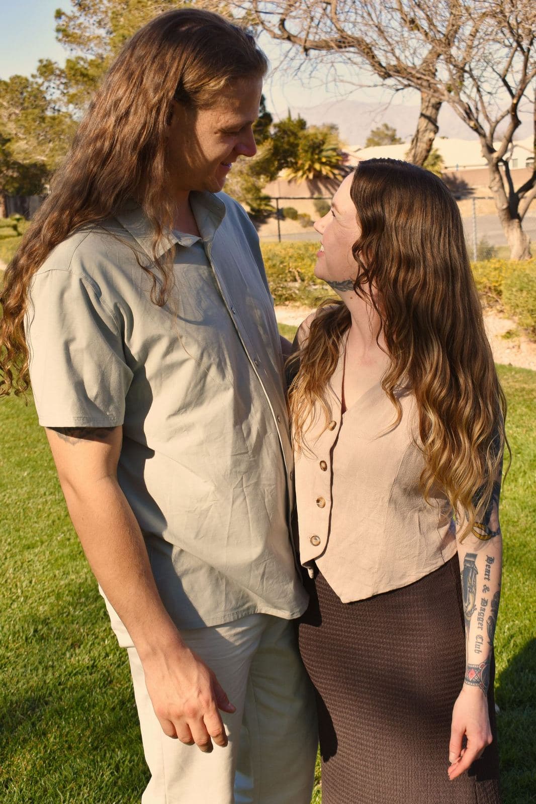 A close portrait of a couple looking at each other during a park session at golden hour in Las Vegas, NV